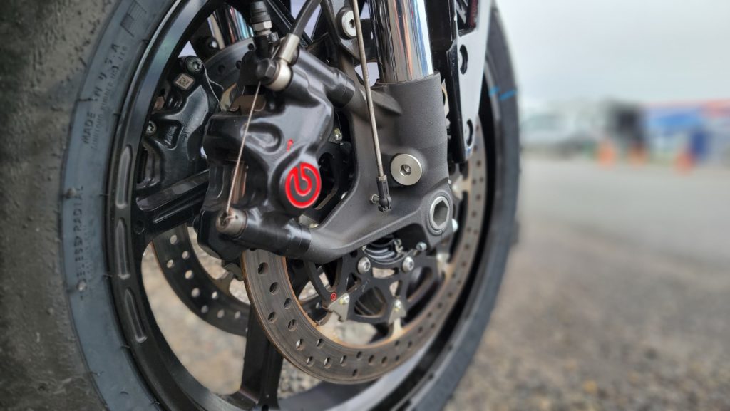 Vance and Hines team used upgraded Brembo Calipers with T-Drive rotors mounted to a CoreMoto rim.  We also see a suspension potentiometer to gather data on the forks. 